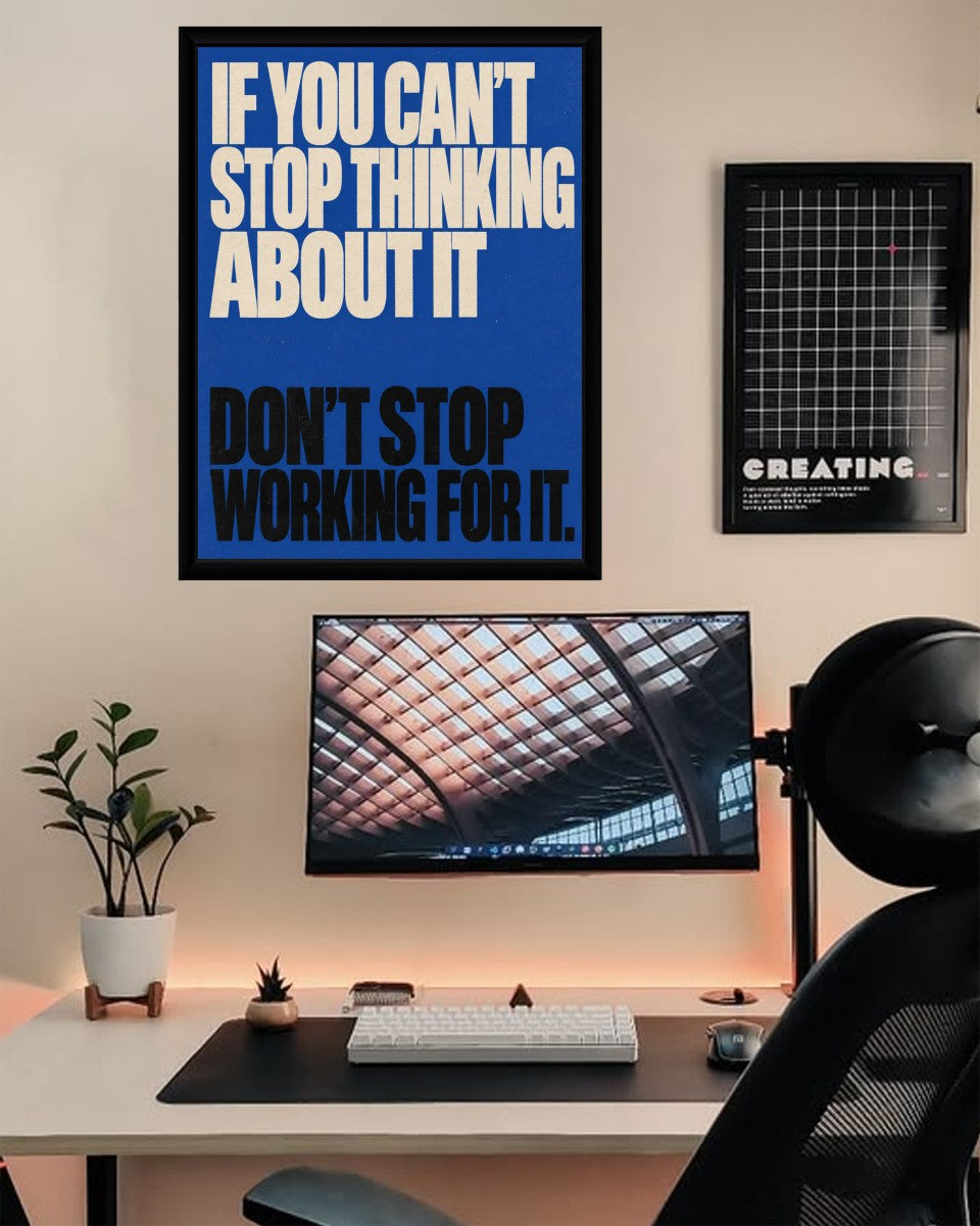 The poster in an artistic workspace, beautifully complementing the creative atmosphere.