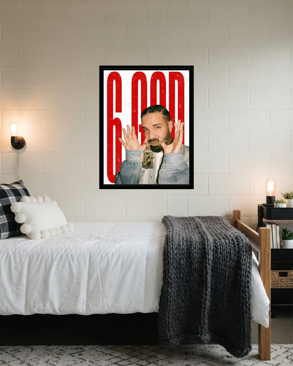 The '6 GOD' poster artistically arranged in a creative workspace, adding flair to the music-themed decor.