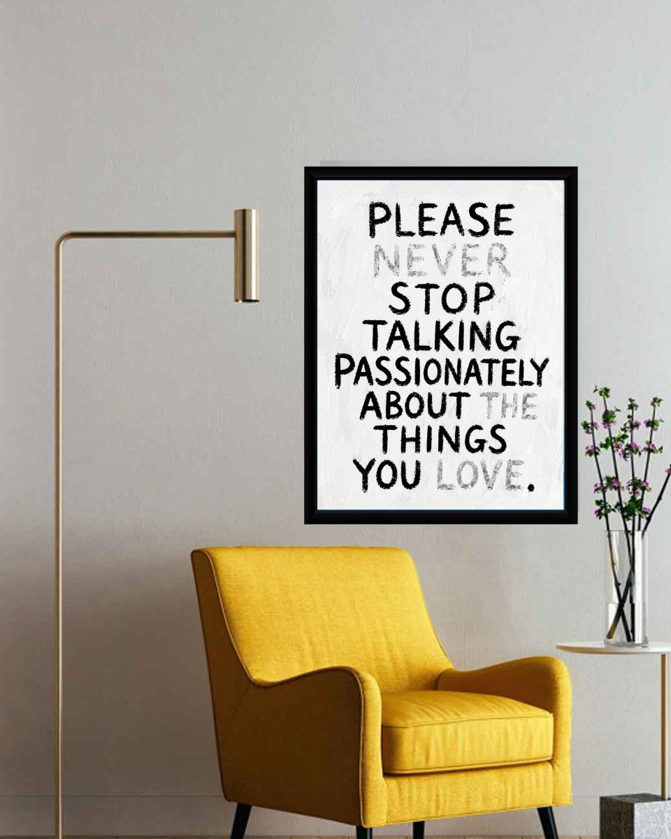 The 'Never Stop Talking' poster displayed in a bright and inspiring workspace setting.