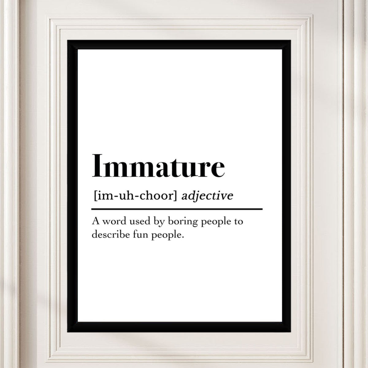 Immature definition poster showcased on a modern desk, surrounded by motivational decor.