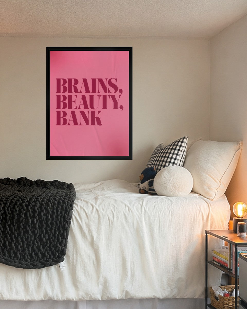 The 'BRAINS, BEAUTY, BANK' poster displayed in a stylish office setup.