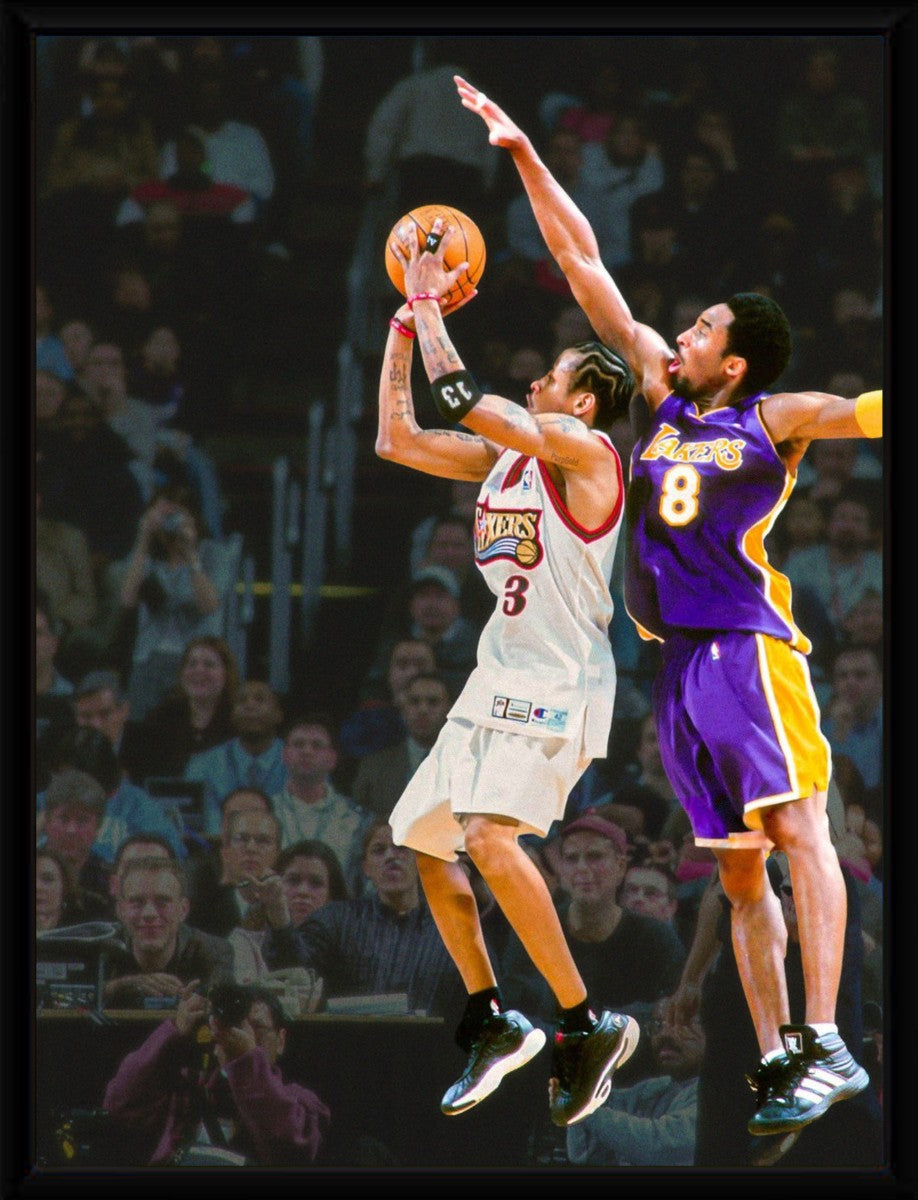 The Iverson Over Kobe poster elegantly framed, showcasing vibrant colors and athletic action in a sleek presentation.