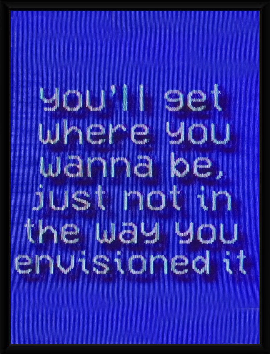 Framed motivational poster showcasing a colorful design with a thoughtful quote.