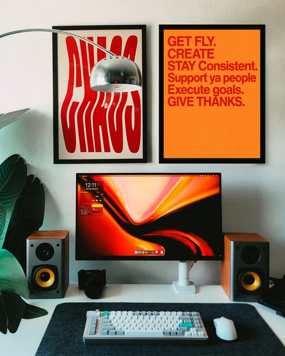 The colorful motivational poster displayed in a bright and airy workspace, highlighting its inspirational message.