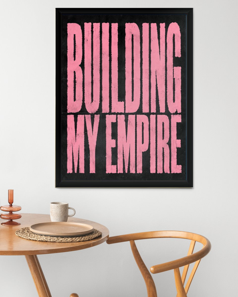 The poster displayed in a chic workspace, enhancing the atmosphere with its empowering text.