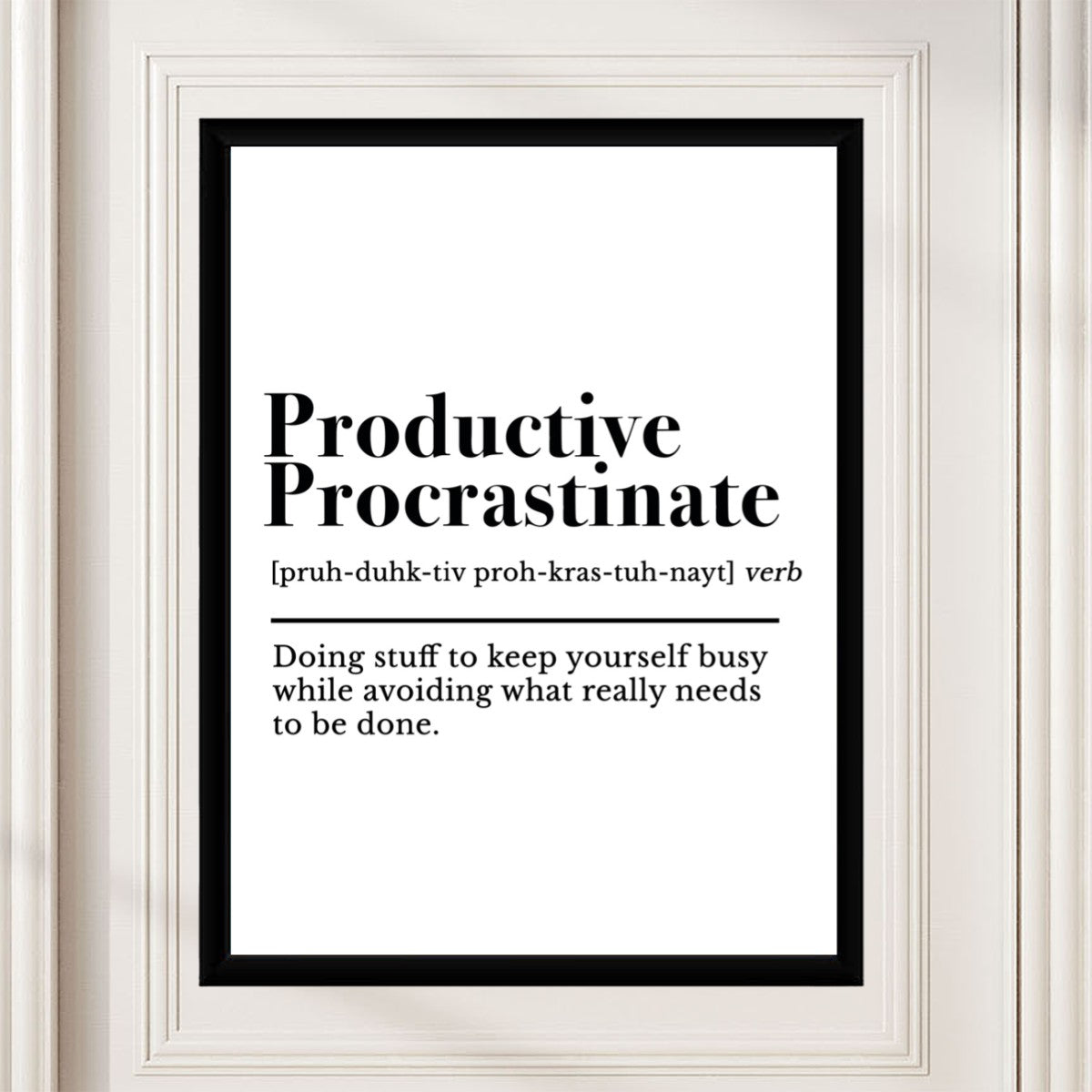 The 'Productive Procrastinate' poster in a well-decorated workspace, adding a touch of humor to the environment.