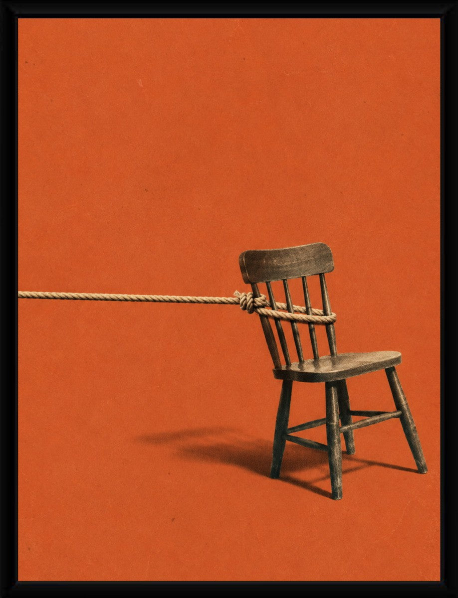 The Red Chair Poster displayed in a sleek black frame against a neutral backdrop.