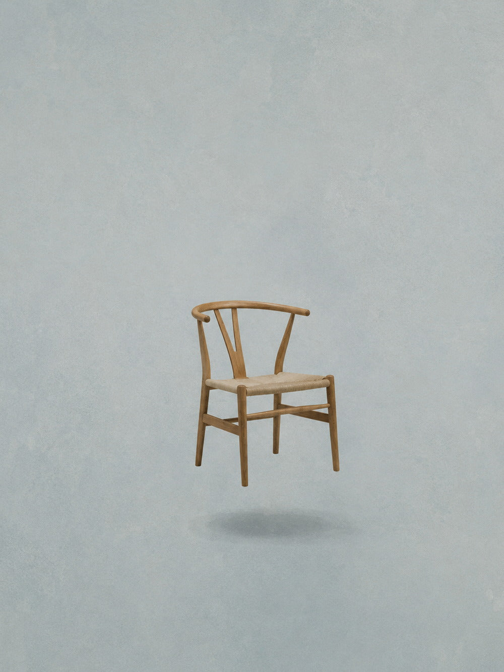 Minimalist poster featuring a floating chair against a soft blue background.