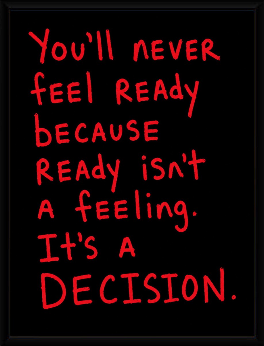 The poster displayed in a sleek black frame, enhancing its motivational message.