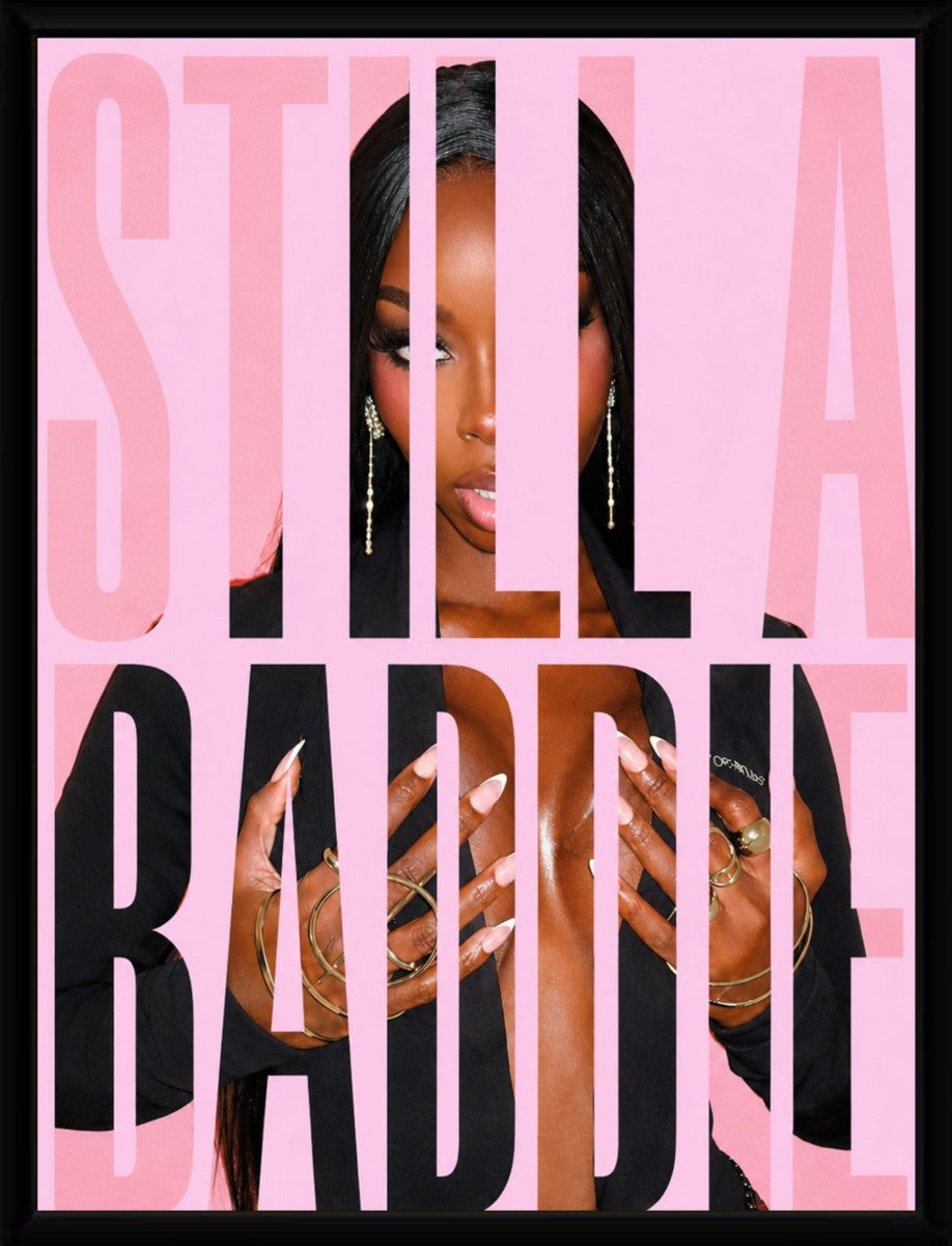 The 'Still a Baddie' poster displayed in an elegant black frame highlighting its vibrant colors.