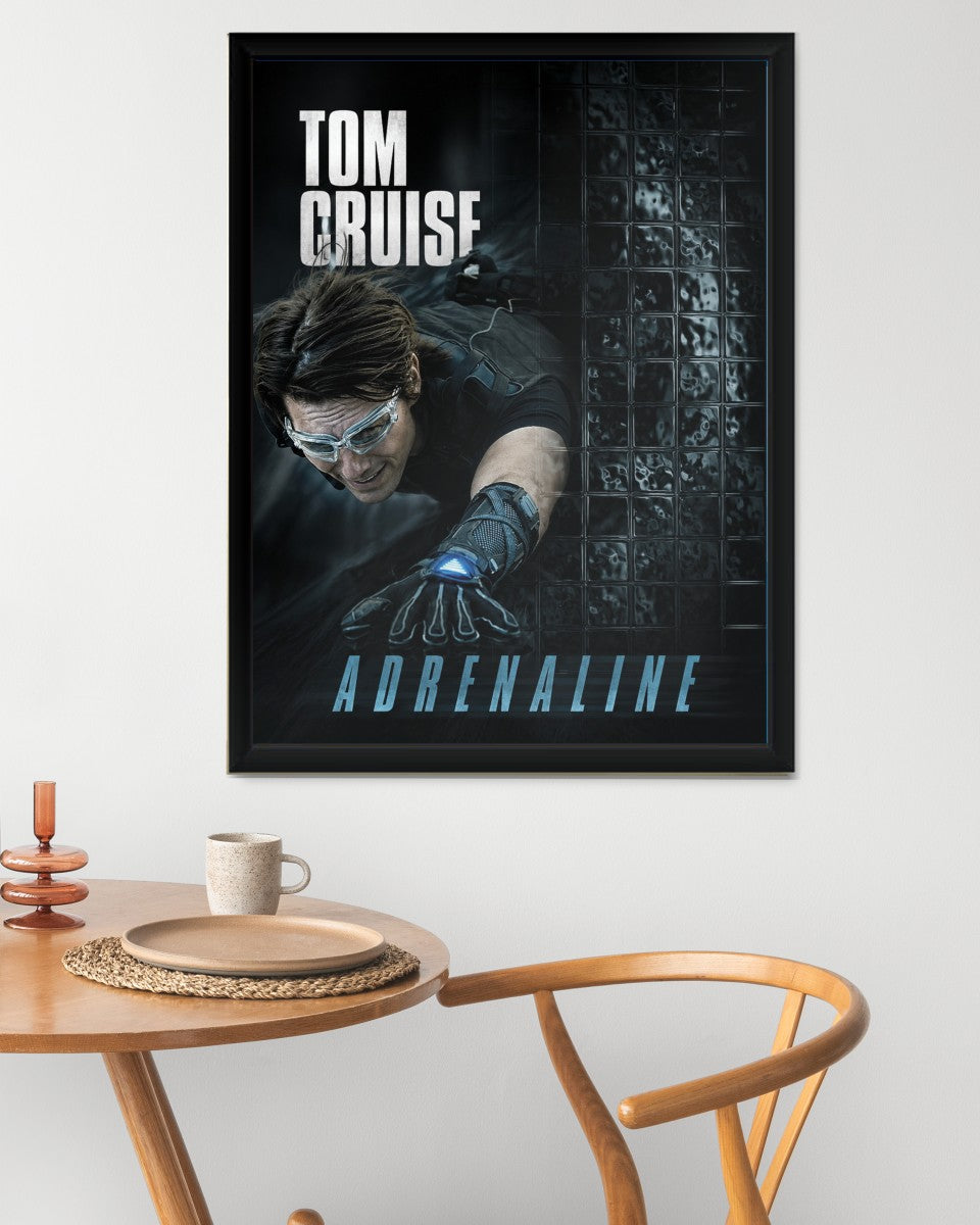The Tom Cruise: Adrenaline Poster presented in a stylish workspace.
