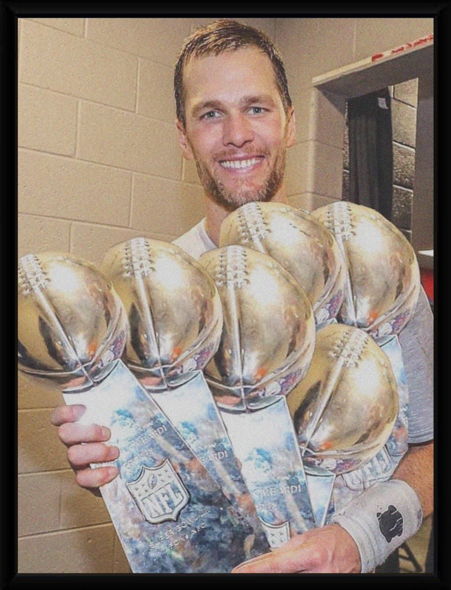 Tom Brady with Championship Trophies Poster elegantly framed, enhancing the presentation.