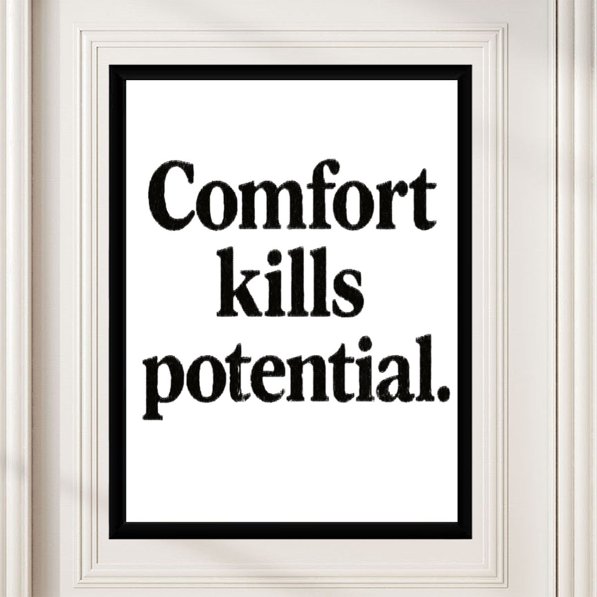 The motivational poster 'Comfort kills potential' styled in a bright and airy study area, enhancing the inspirational