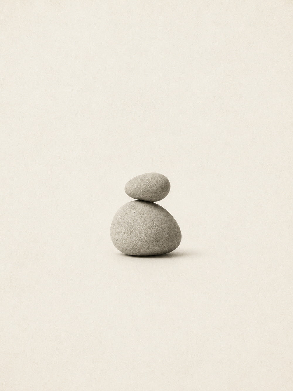 A minimalist poster featuring a harmonious arrangement of balanced stones in a neutral palette.