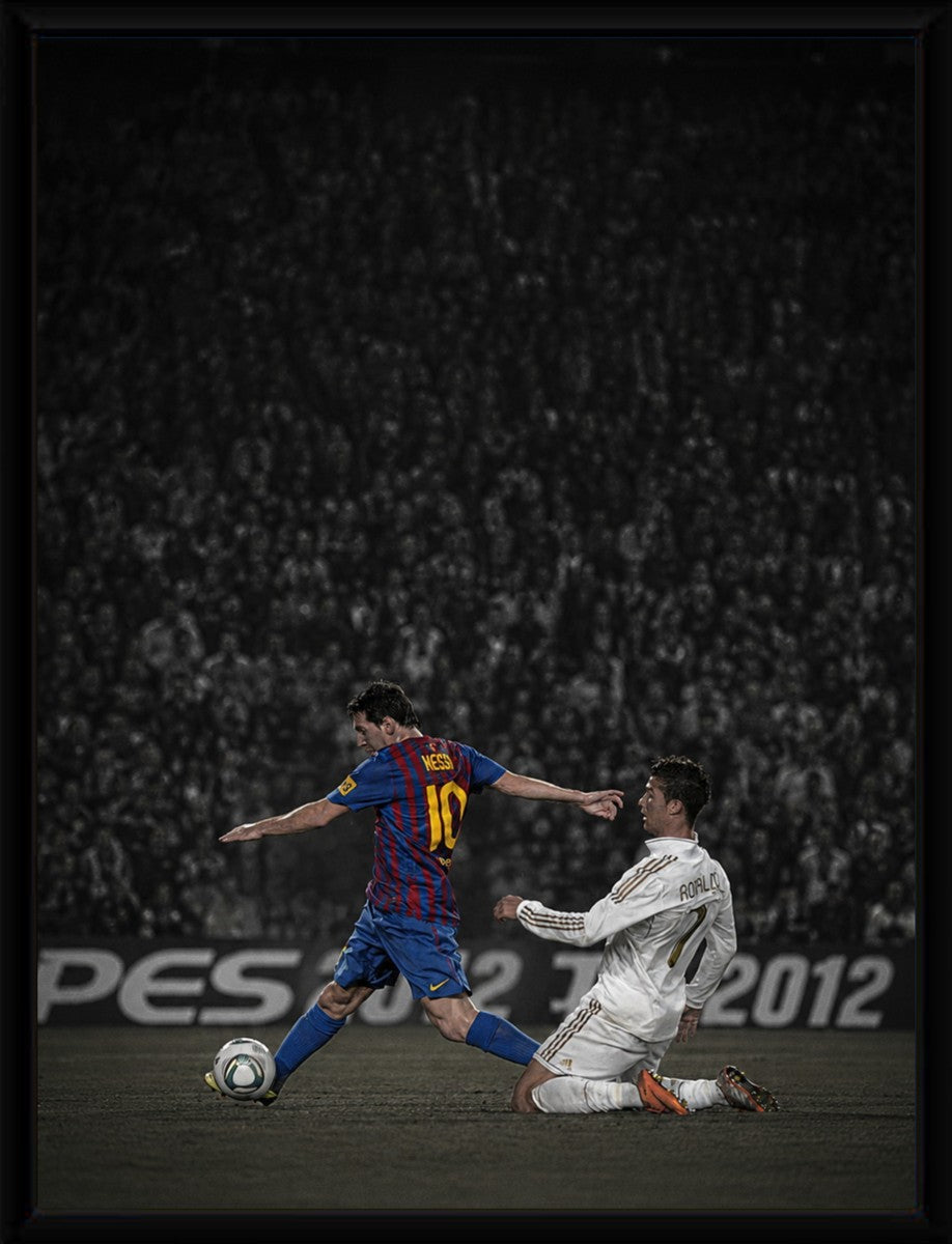 Messi vs Ronaldo poster displayed in a sleek black frame.