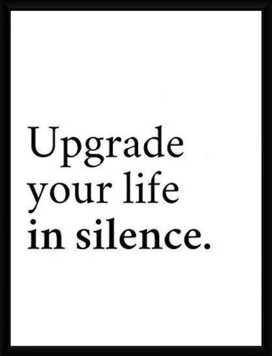 Framed poster displaying the quote 'Upgrade your life in silence.' in a stylish pure frame.