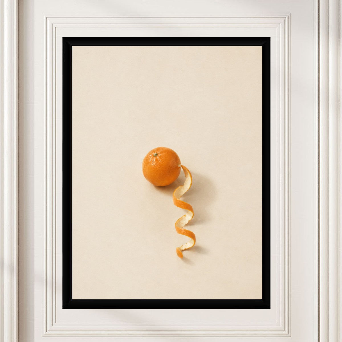The orange fruit poster styled on a stylish desk with office accessories around it.
