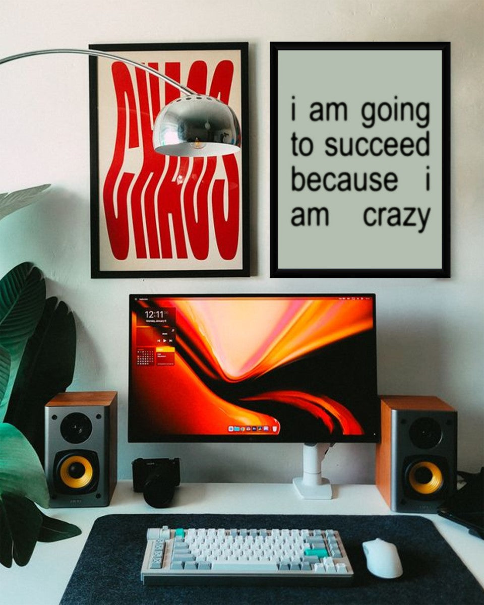 The 'Crazy for Success' poster in a bright and stylish home office setting.