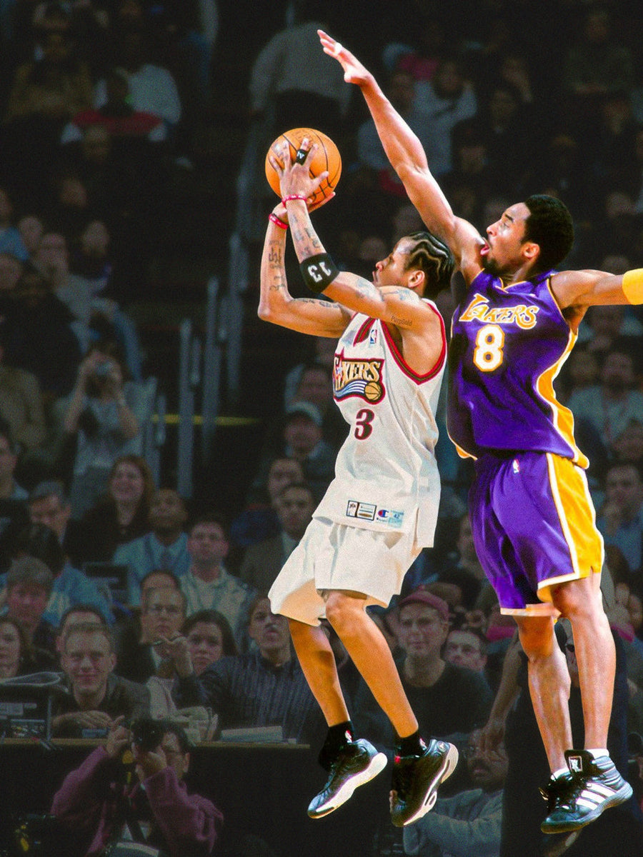 A colorful poster featuring Allen Iverson in a dynamic pose as he soars over Kobe Bryant, capturing an intense basketball