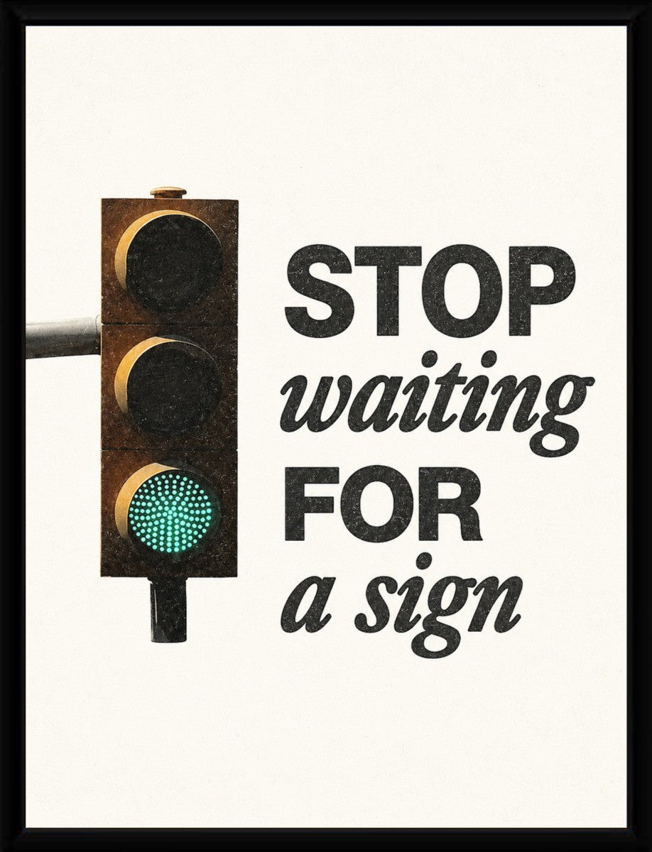 A framed version of the motivational poster displaying the text 'STOP waiting FOR a sign' in an elegant setting.