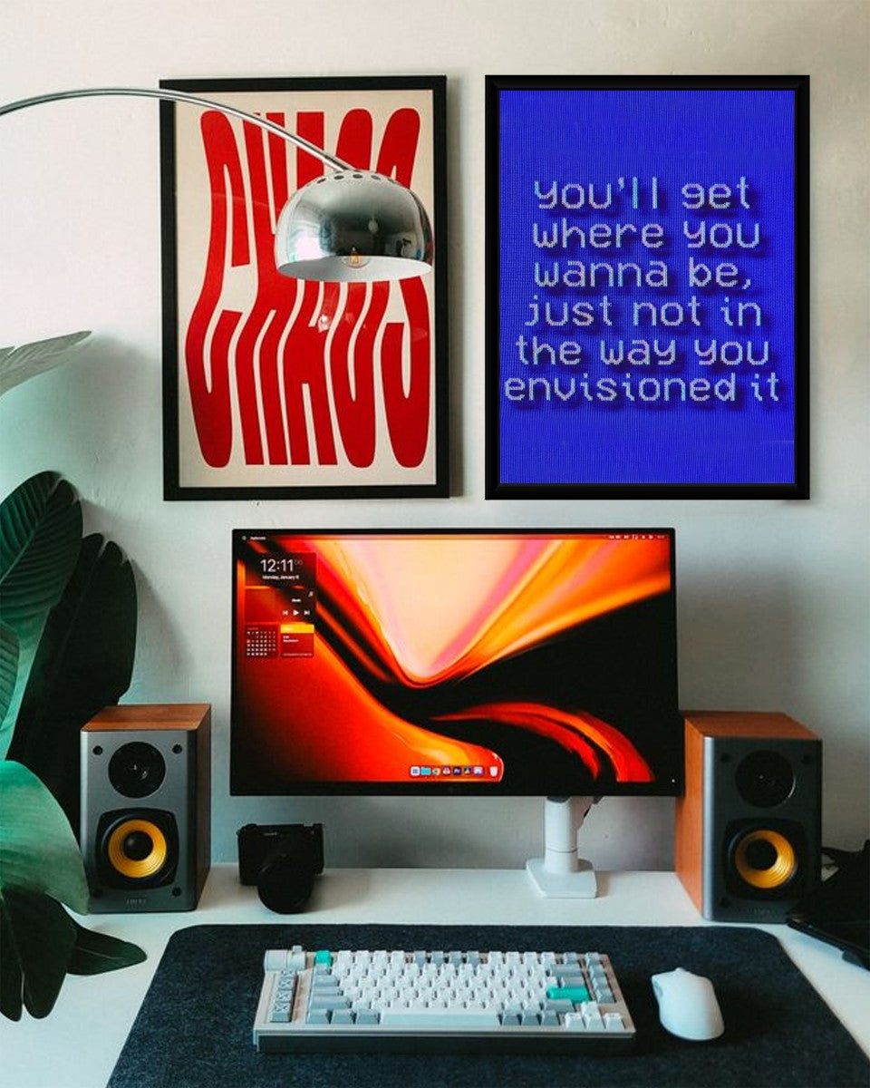 Envisioned Journey Poster displayed in a well-decorated office setting.