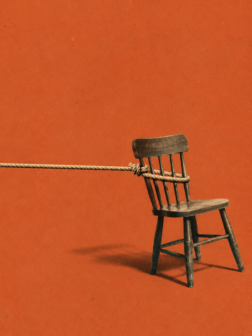 A striking poster of a rustic wooden chair tethered with rope against a vivid red background.