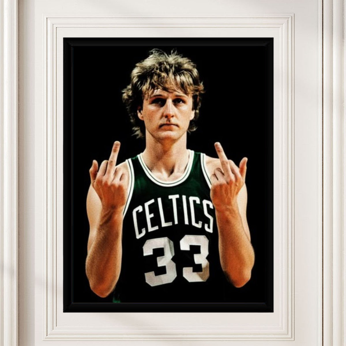 Larry Bird poster styled in a modern home office setting, adding a sporty touch.