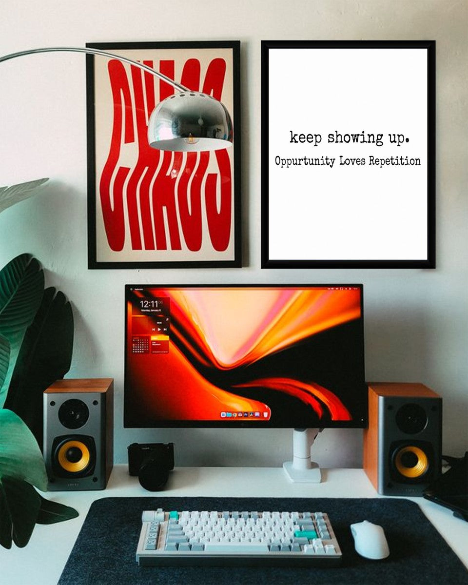 The 'Keep Showing Up' poster displayed in a styled mockup, emphasizing its motivational message.
