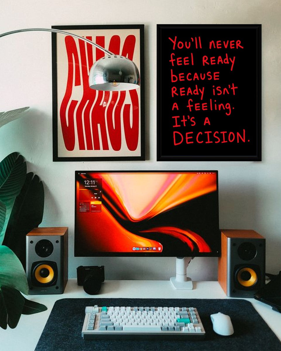 The motivational poster shown in a stylish office setting with a dark background.
