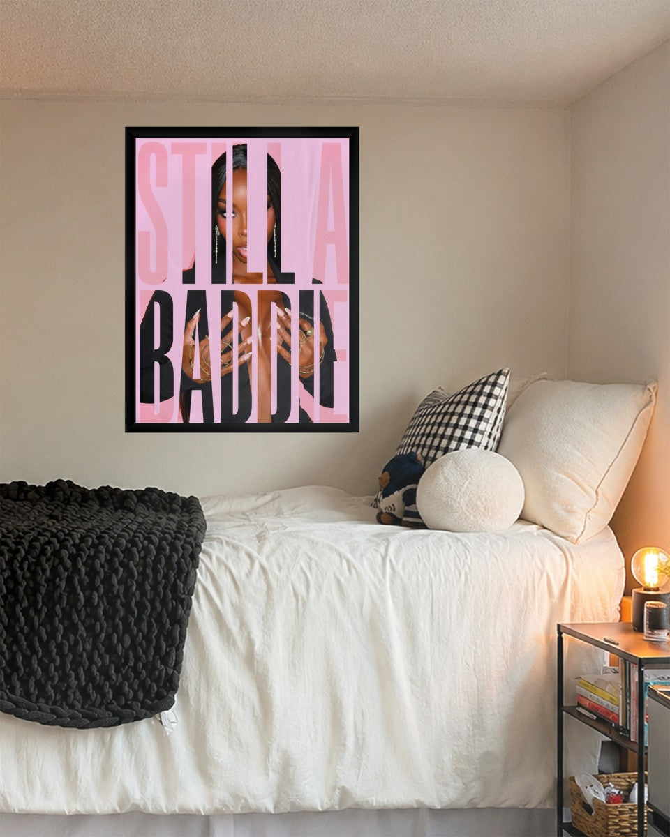 The 'Still a Baddie' poster showcased in a stylish mockup setting with bright decor accents.