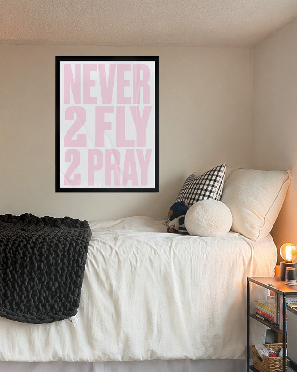 Motivational poster displayed on a stylish wall with soft pink accents.