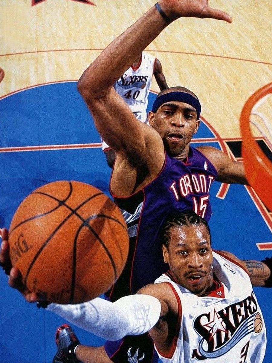 A vibrant poster depicting Vince Carter in mid-air during an iconic dunk, showcasing dynamic movement and athleticism.